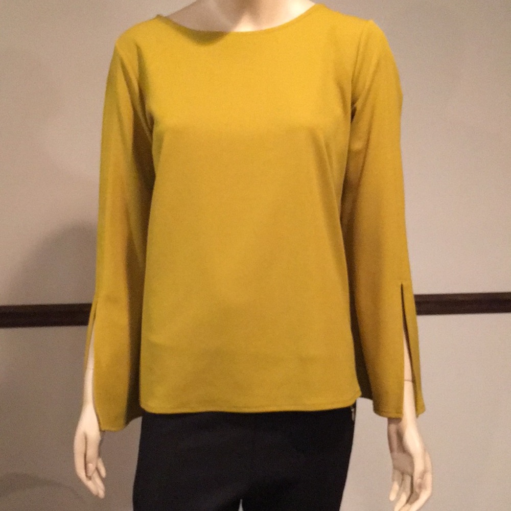 Long sleeved pullover blouse.